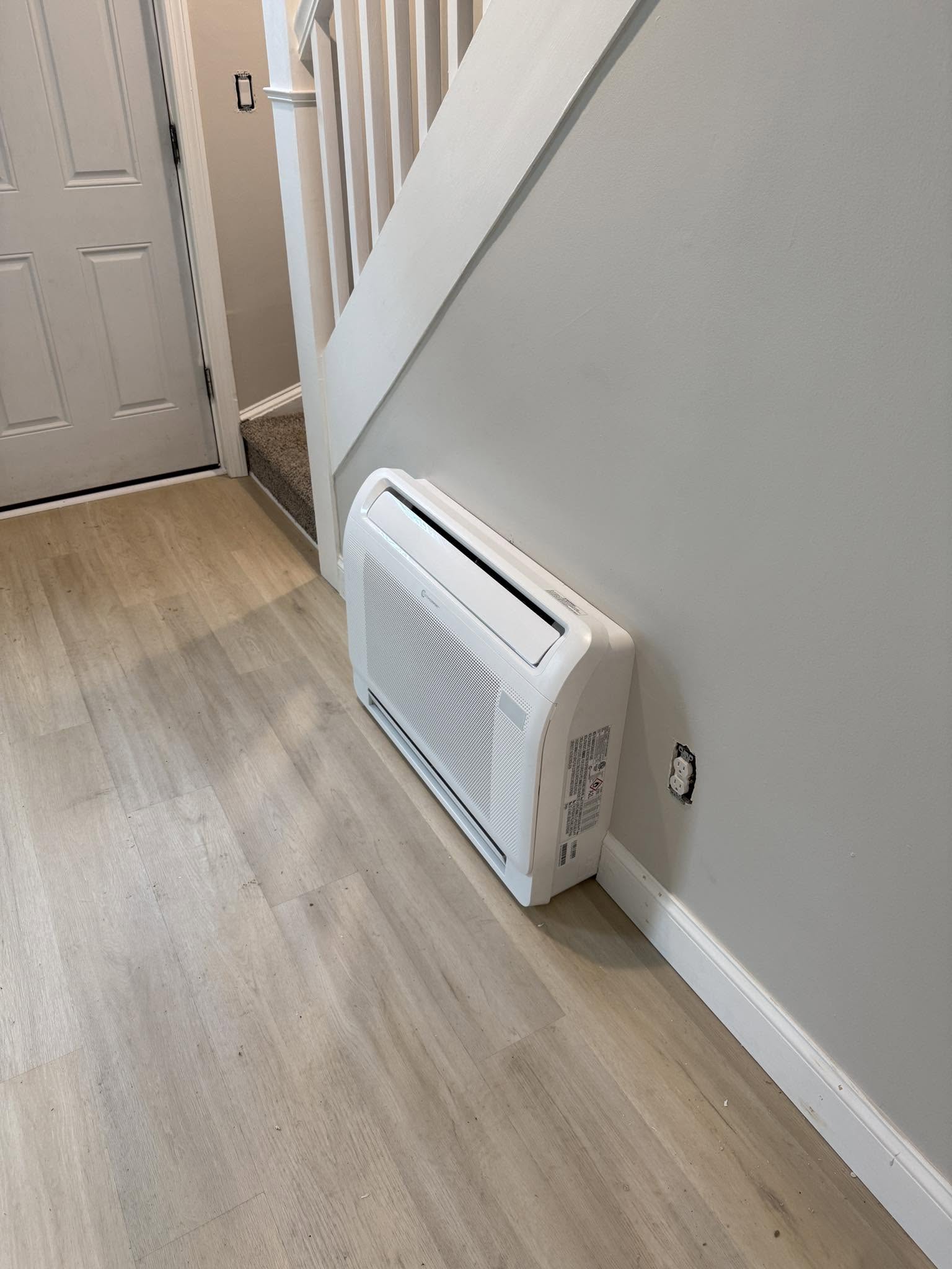 Floor-mounted ductless heating and cooling unit